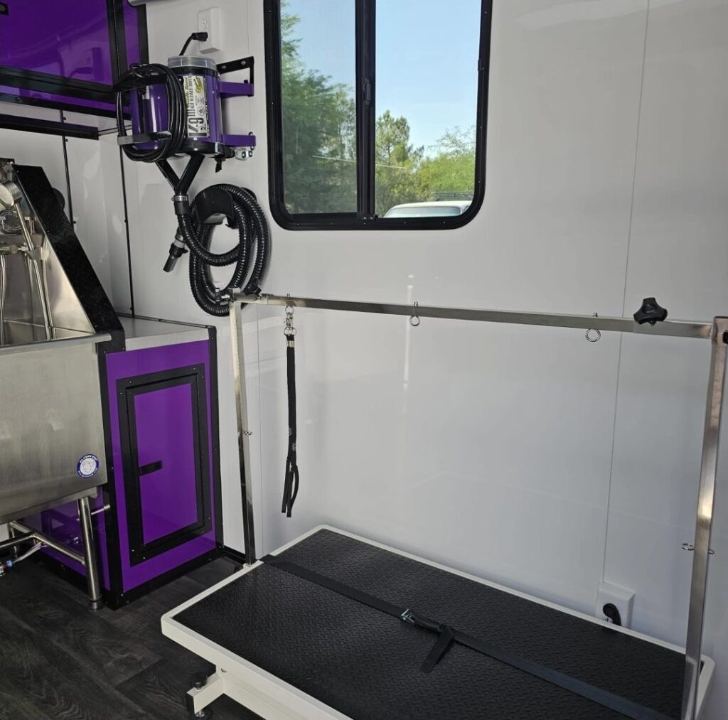 Grooming table and bath inside the Lavish Licks trailer